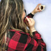 women applying mascara with mirror