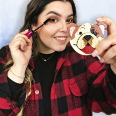 women applying makeup with boxer themed mirror