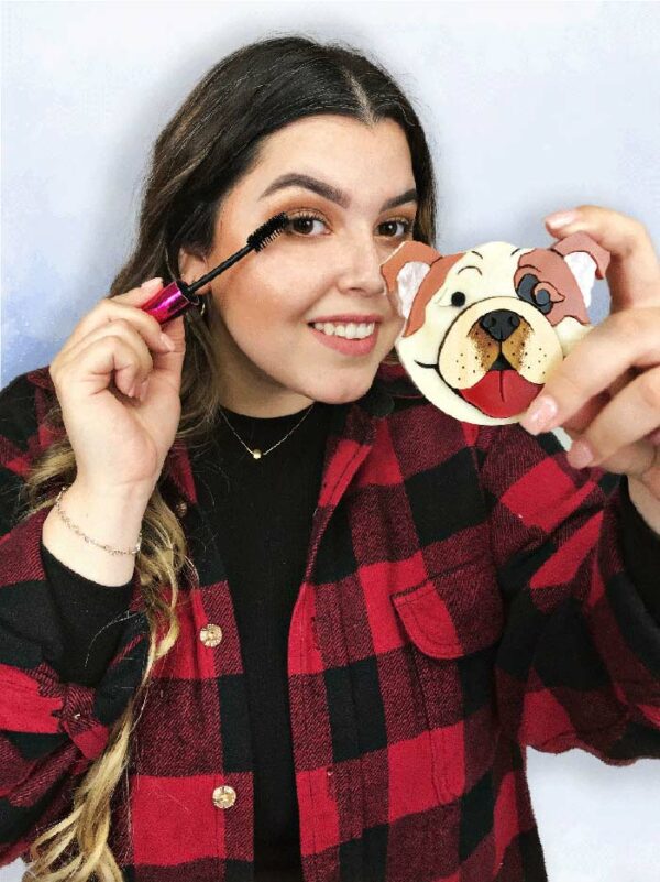 women applying makeup with boxer themed mirror