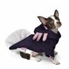 Dog wearing purple axolotl costume looking sideways