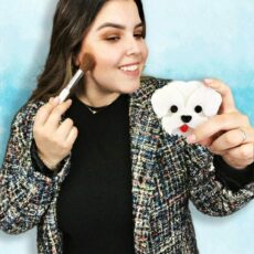 women applying makeup with poodle themed mirror