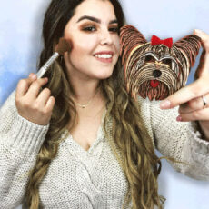 women applying makeup with yorkie themed mirror